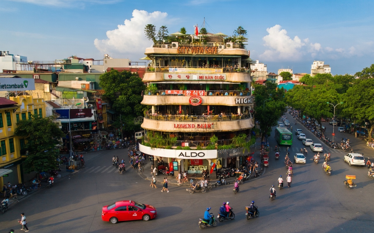 Hanoi Old Quarter streets with ancient architecture and street vendors